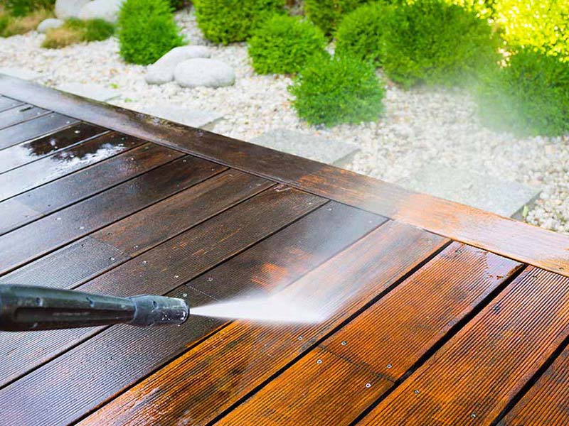 wooden deck being power washed stoughton wi